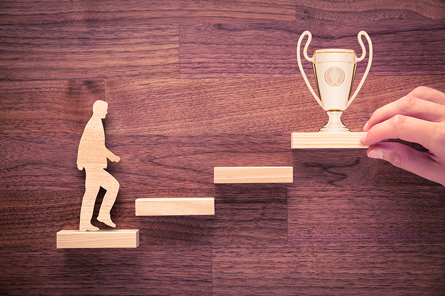 Personal development, personal and career growth, progress and potential concepts. Coach (human resources officer, manager, mentor) motivate employee to growth with cup.
